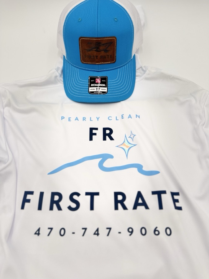 First Rate Pearly Clean package — cyan and white Richardson 112 trucker with a laser-engraved leather patch, laid over a matching white performance long-sleeve