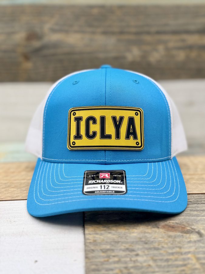 ICLYA yellow licence-plate style patch on a light blue and white Richardson 112 trucker cap
