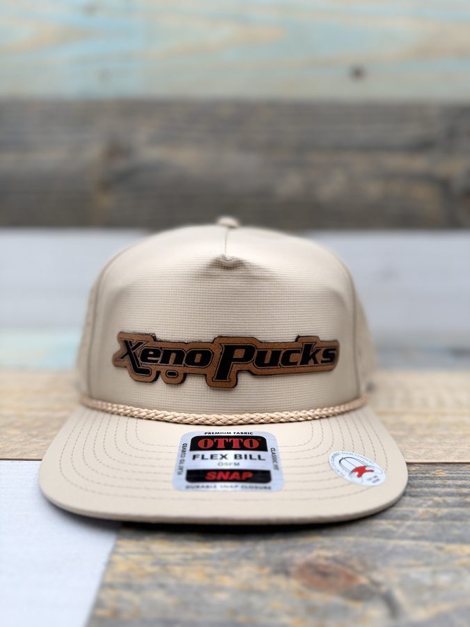 Xeno Pucks tan OTTO rope cap with a laser-engraved leather patch